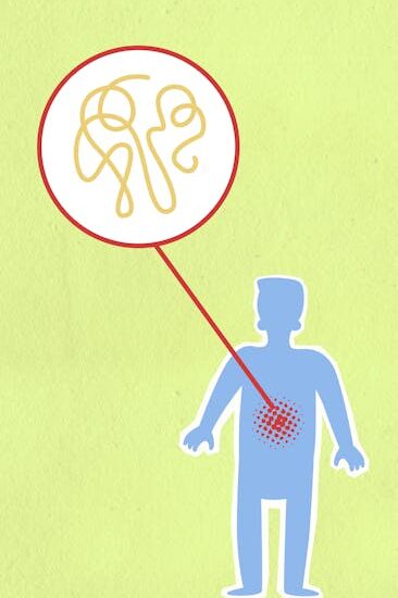 Cardboard illustration of sick human figure with genetic material in organism on green background