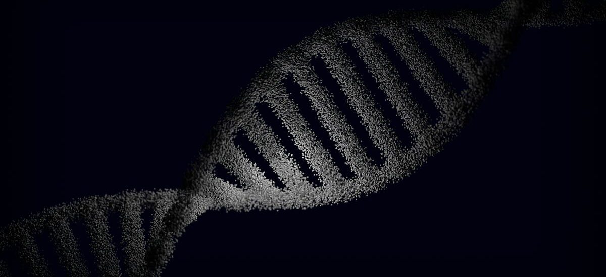 Artistic rendering of a DNA strand with particle effects against a dark background.
