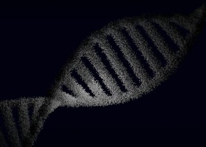 Artistic rendering of a DNA strand with particle effects against a dark background.