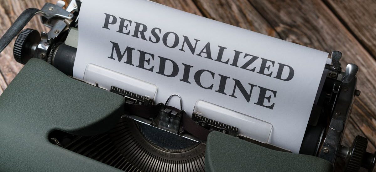 Close-up of a vintage typewriter with paper displaying 'Personalized Medicine' text.