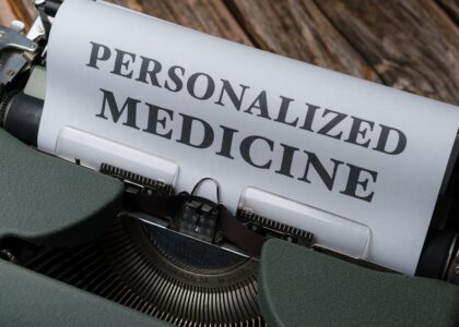 Close-up of a vintage typewriter with paper displaying 'Personalized Medicine' text.